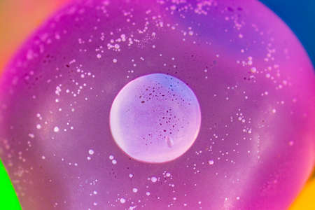 Colorful water balloons, water bombs close-up. Bright blurred background.の写真素材