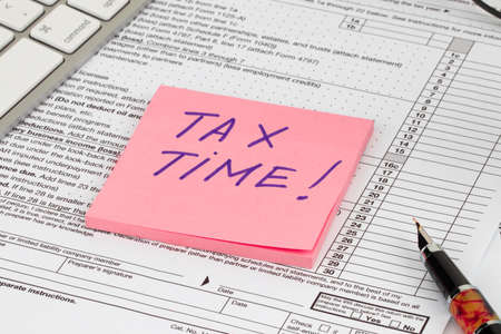 Tax time - Notification of the need to file tax returns, tax form at accauntant workplace.の写真素材