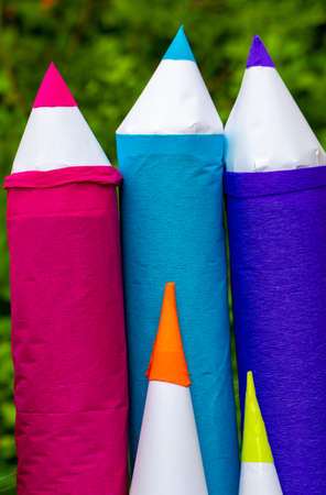 Huge colored pencils in blue, pink and purple. Homemade decor element school holiday.の写真素材
