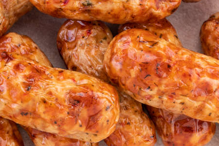 Tasty grilled sausage on the wooden background.の写真素材