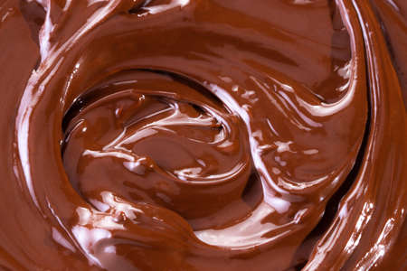 Chocolate texture. Liquid chocolate close-up.Textured dark chocolate.の写真素材