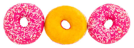 Pink donut with colorful sprinkles isolated on whiteの写真素材