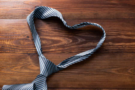 Tie the shape of a heart on woodenの写真素材