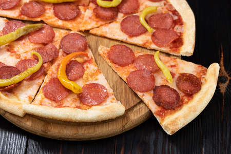 Tasty pepperoni pizza on wood background. Top view of hot pepperoni pizza.の写真素材