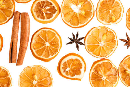 Cinnamon sticks, slices of dried lemon, star anise isolated on white background. Top view.の写真素材