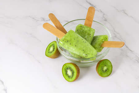 Frozen fruit kiwi juice in a bowl.の写真素材