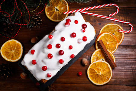 Christmas cake with cranberries. Christmas stollen and Christmas decorations. Top view with copy space.の写真素材