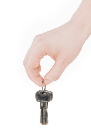 keys in hand isolated on white background.の写真素材
