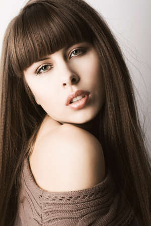 Closeup portrait of beautiful young woman looking at cameraの写真素材