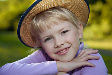 Beautiful blond girl smiling outdoorの写真素材