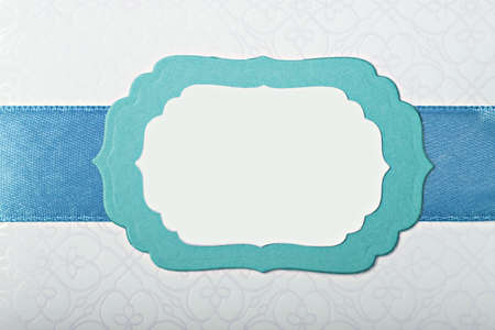 Beautiful turquoise paper frame with ribbonの写真素材