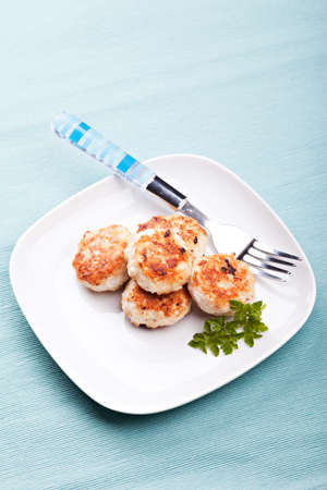 Meatballs in blue bowls on table
