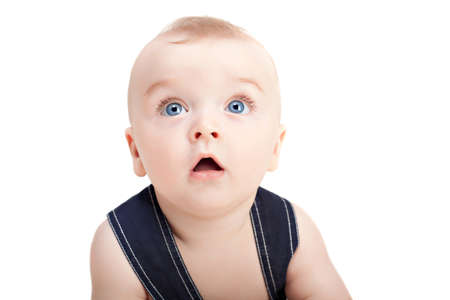 Cute beautiful little boy looking at camera. Isolated on white backgroundの写真素材