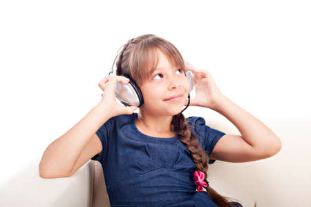 Girl with headphones on white backgroundの写真素材