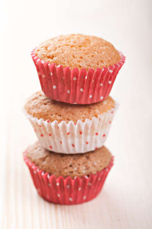 Homemade muffins stack on wooden backgroundの写真素材