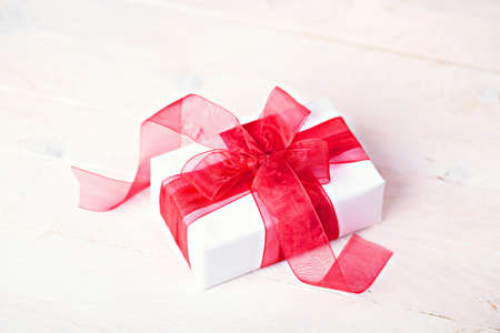 Giftbox with red ribbonの写真素材