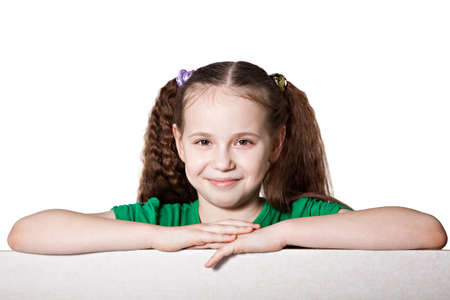 Cute caucasian girl with blank board isolated over whiteの写真素材