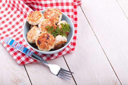 Meatballs in blue bowls on tableの写真素材