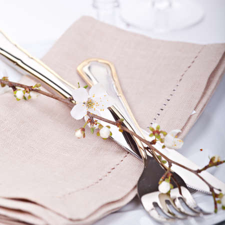 Table setting with blossoming spring flowersの写真素材