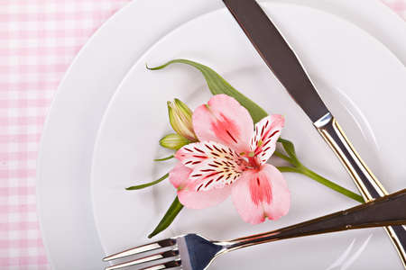 Spring decoration with pink alstromeria of a festive table
