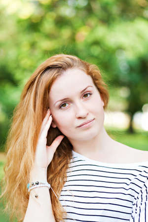 Young beautiful woman, on green background