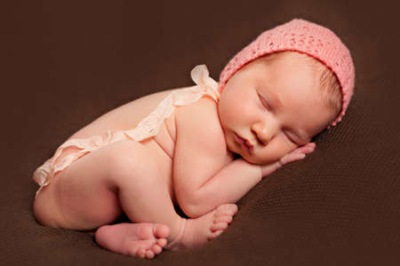 Newborn baby girl sleepingの写真素材