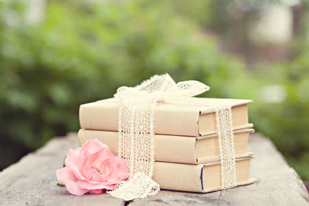 Vintage image with old books on wooden backgroundの写真素材