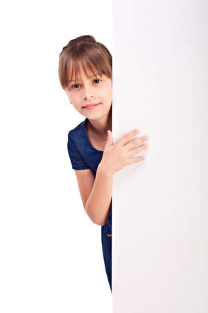 Smiling girl with blank billdboard isolated on white background の写真素材