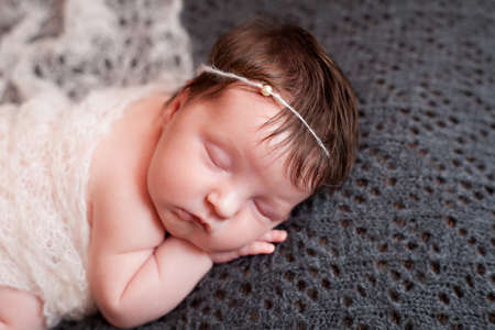 Portrait of  sleeping newborn baby girlの写真素材