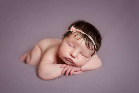 Portrait of  sleeping newborn baby girlの写真素材