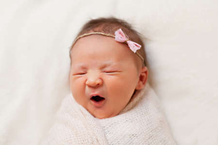 Portrait of  sleeping newborn baby girlの写真素材