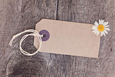 Blanket ecotag on wooden backgroundの写真素材