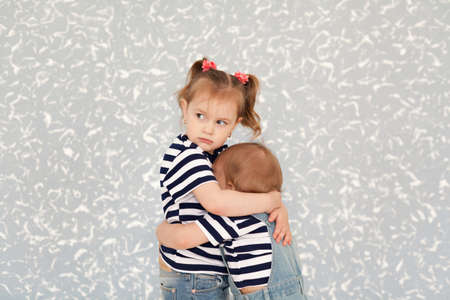 Sister's love. Protects the child's older sisterの写真素材