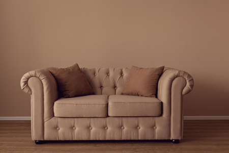 Beautiful beige textile sofa in the roomの写真素材