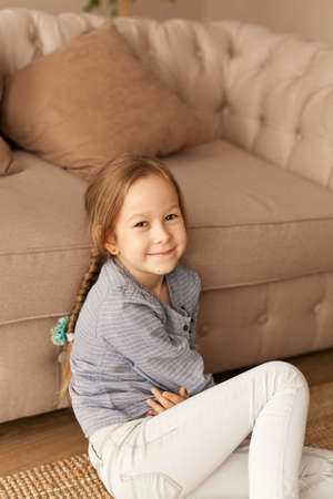 Portrait of a seven year old girl at home