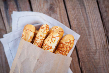 cheese bread sticks on wooden backgroundの写真素材