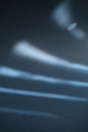 Defocus navy blue paper background with sun glare