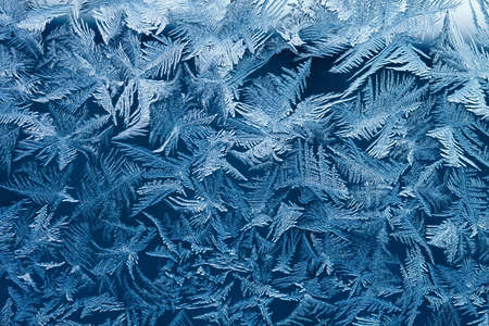 Beautiful natural frosty pattern on winter window.
