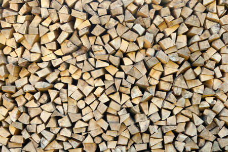 Closeup of chopped firewood logs stacked in a pile