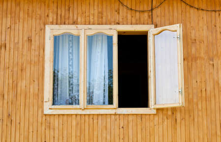 Window in a wooden house with clapboardの写真素材
