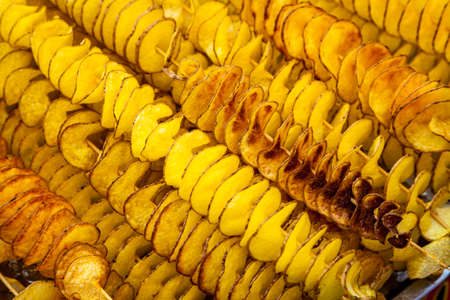 Potatoes sliced spitalyu fried in boiling fatの写真素材