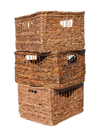 Wicker boxes made of waste paper isolated on white background