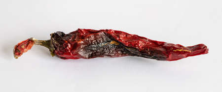 Bad tainted chili pepper on a light backgroundの写真素材