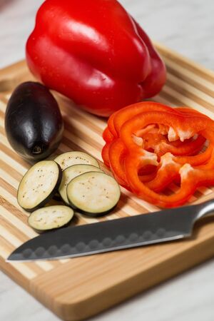 Fresh chopped vegetables on a cutting Boardの写真素材