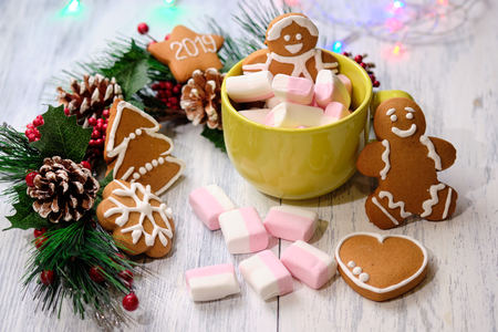 almond cookies and marshmallow on white background with Christmas tree ,  candles and christmas...