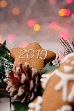 ginger biscuit on white background with Christmas tree ,  candles and christmas lights. Close upの写真素材