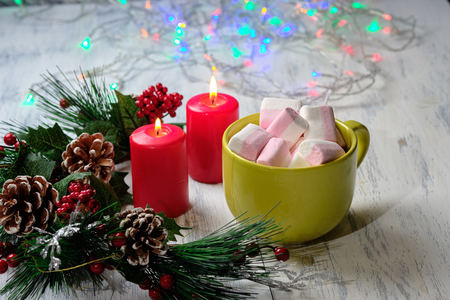 marshmallow on white background with Christmas tree ,  candles and christmas lightsの写真素材
