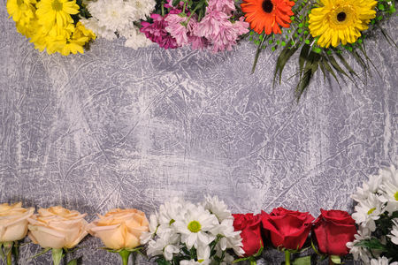 Colorful flowers on grey background.Bouquet of flowers. Copy space