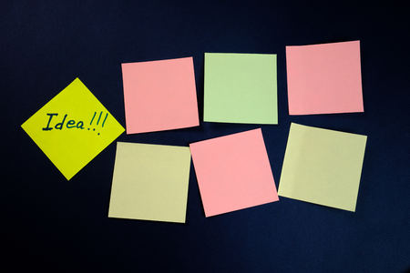 colored blank stickers and one separately on a dark blue background. Close upの写真素材