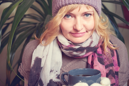 Woman with a Cup of tea in her handsの写真素材